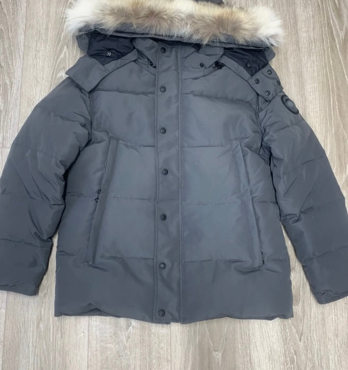 Grey parka black badge